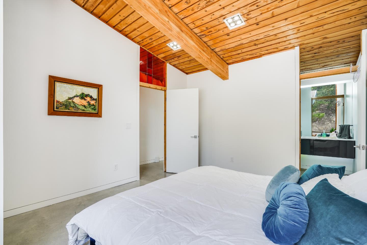 18518 Favre Ridge Road Los Gatos, CA 95033 - Photo 33 of 46 a bedroom with a bed and a painting on the wall