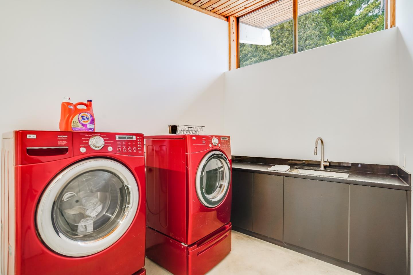 18518 Favre Ridge Road Los Gatos, CA 95033 - Photo 39 of 46 a utility room with sink dryer and washer