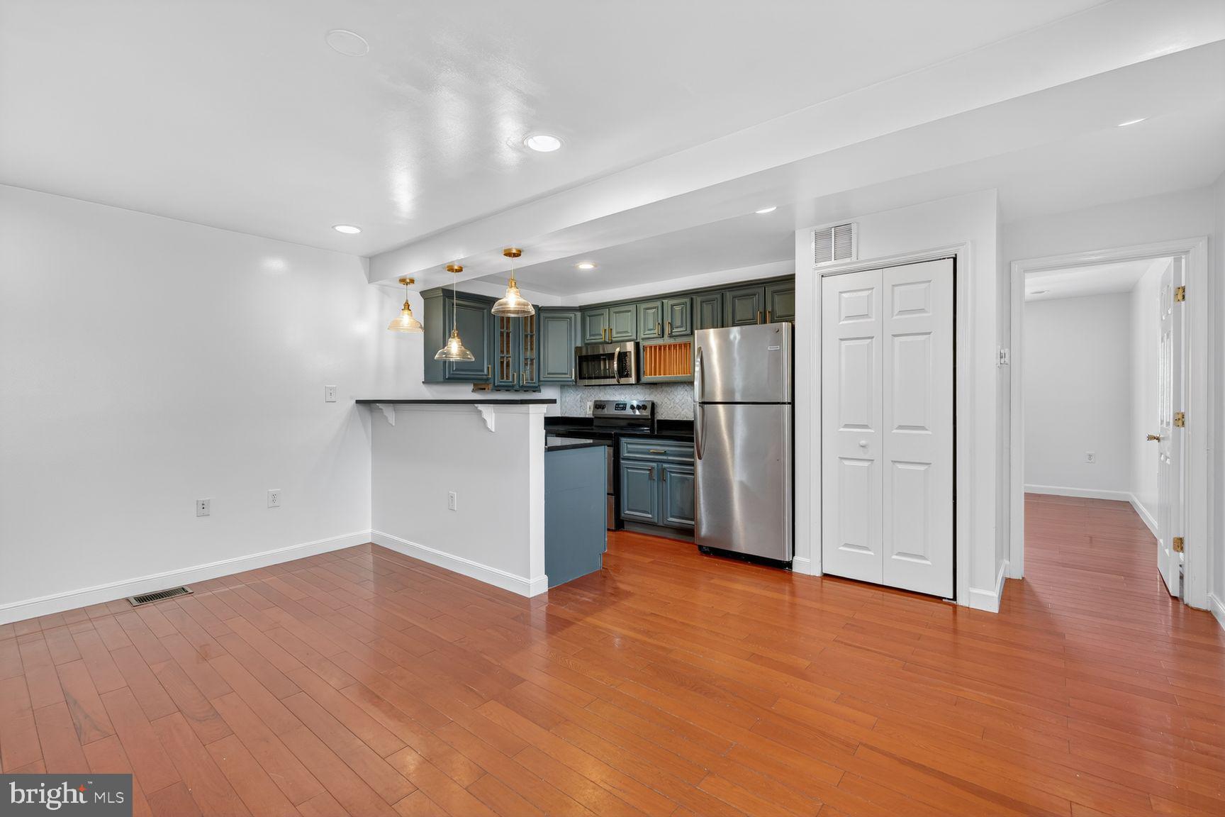 2913 8th Street Southeast, Unit 3101 Washington, DC 20032 - Photo 5 of 33 Living Area into Kitchen