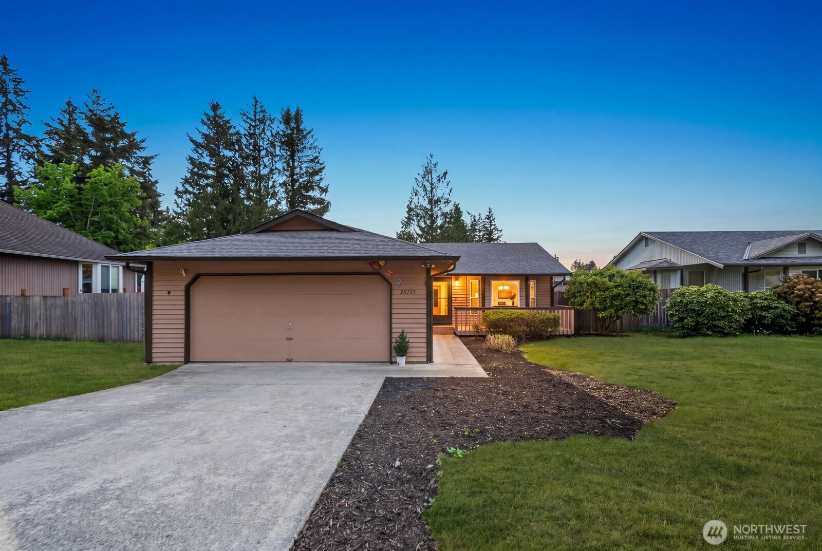 26121 193rd Place Southeast Covington, WA 98042 - Photo 1 of 21 a front view of a house with a yard and garage