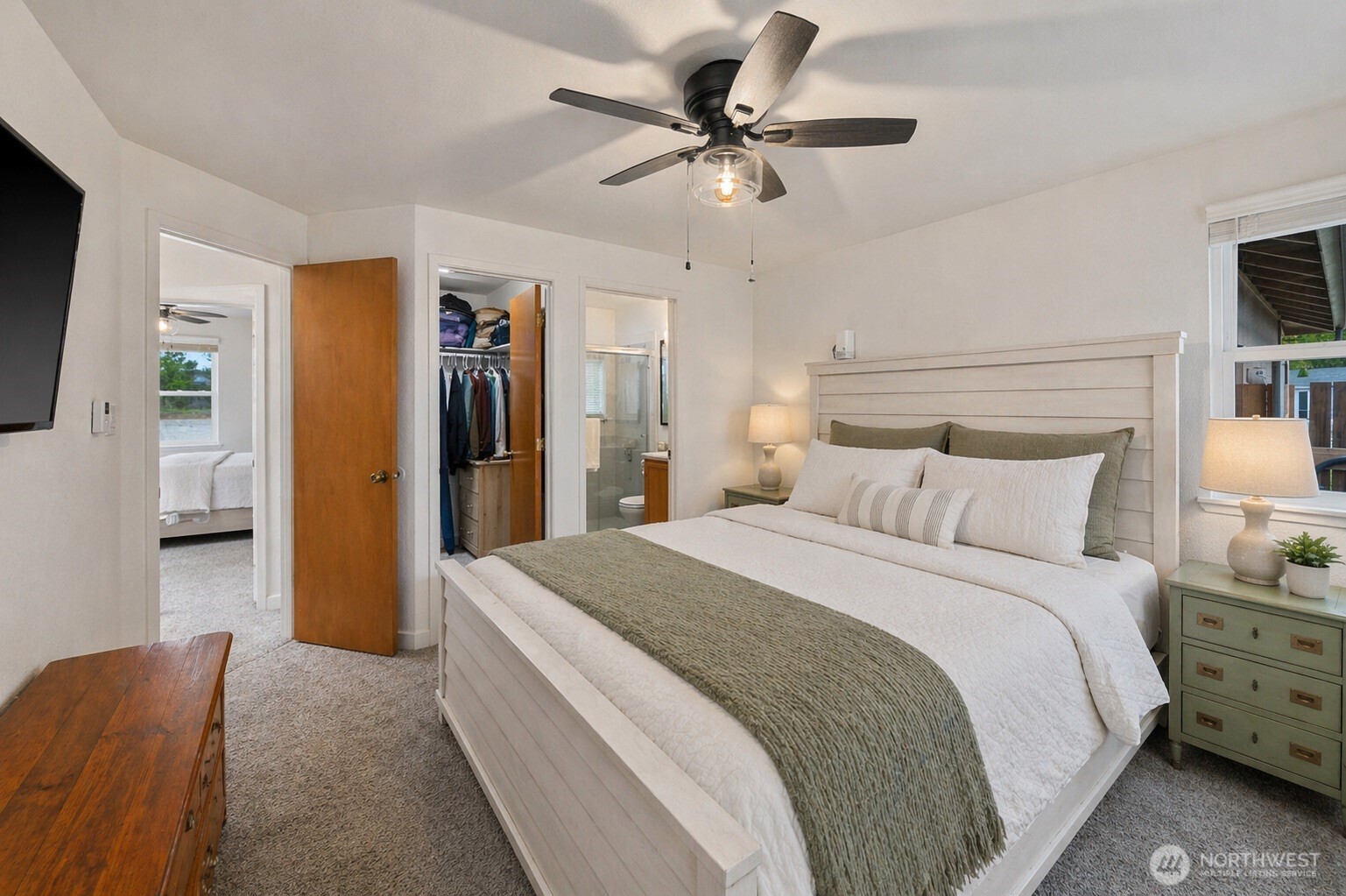 26121 193rd Place Southeast Covington, WA 98042 - Photo 11 of 21 a spacious bedroom with a bed and a chandelier