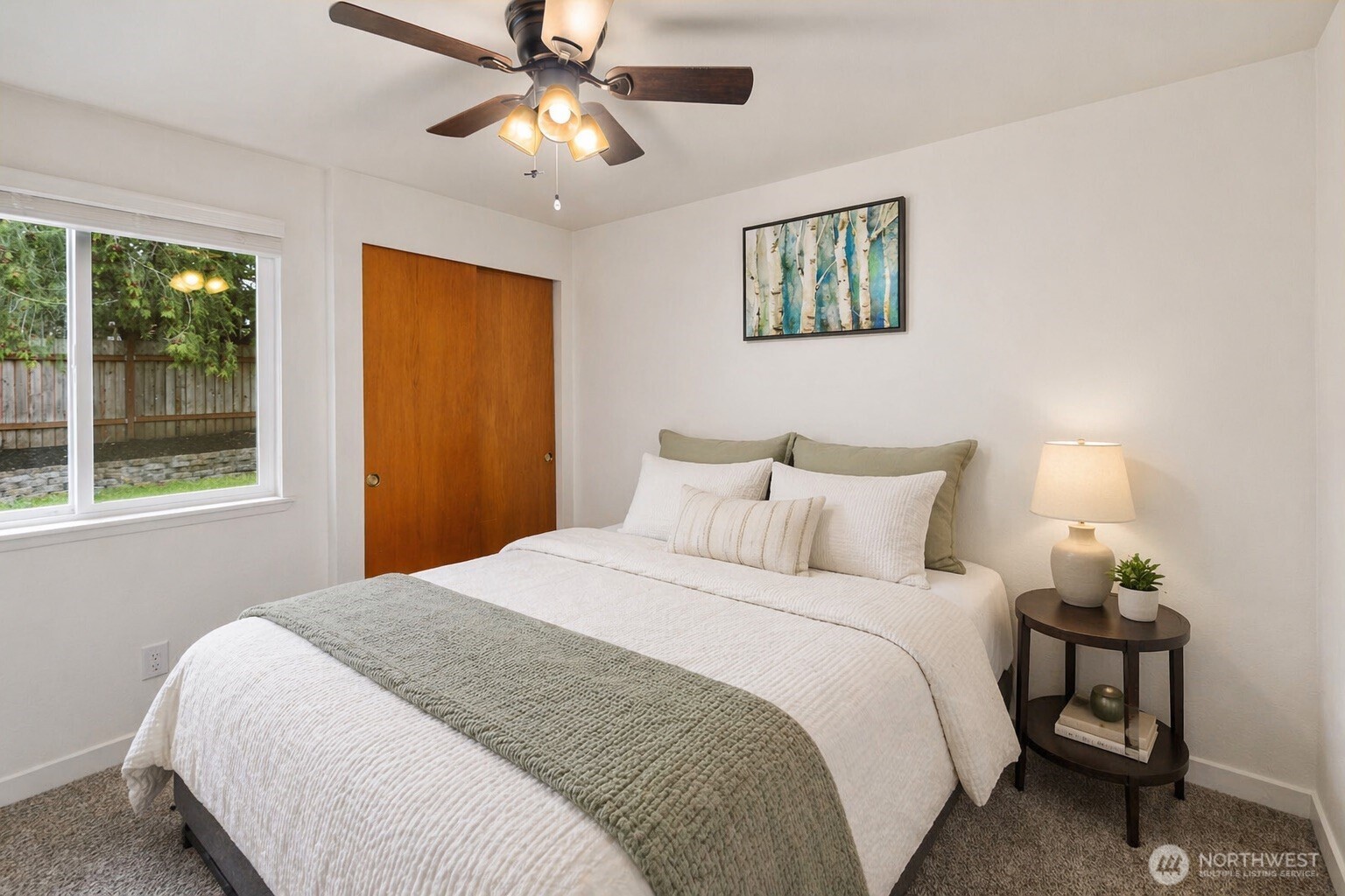 26121 193rd Place Southeast Covington, WA 98042 - Photo 14 of 21 a bedroom with a large bed and a window