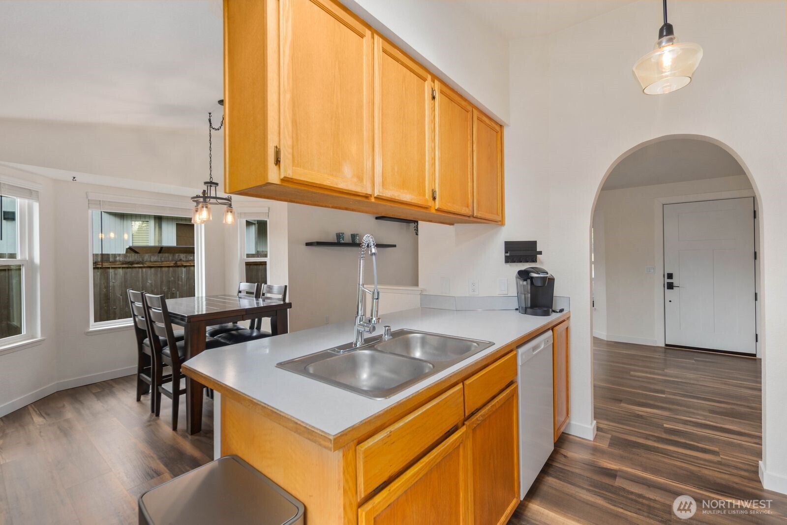 26121 193rd Place Southeast Covington, WA 98042 - Photo 9 of 21 a kitchen with stainless steel appliances granite countertop a sink a stove and island