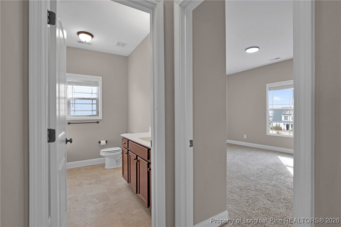 171 Tellmont Street Raeford, NC 28376 - Photo 21 of 46 a spacious bathroom with a toilet sink and shower