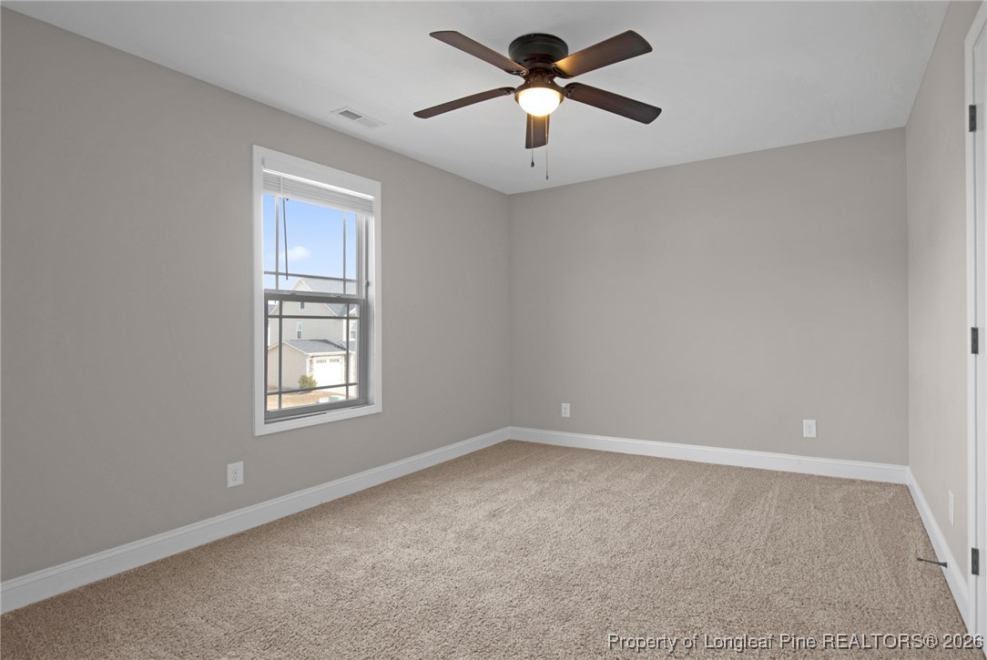 171 Tellmont Street Raeford, NC 28376 - Photo 33 of 46 an empty room with windows and fan