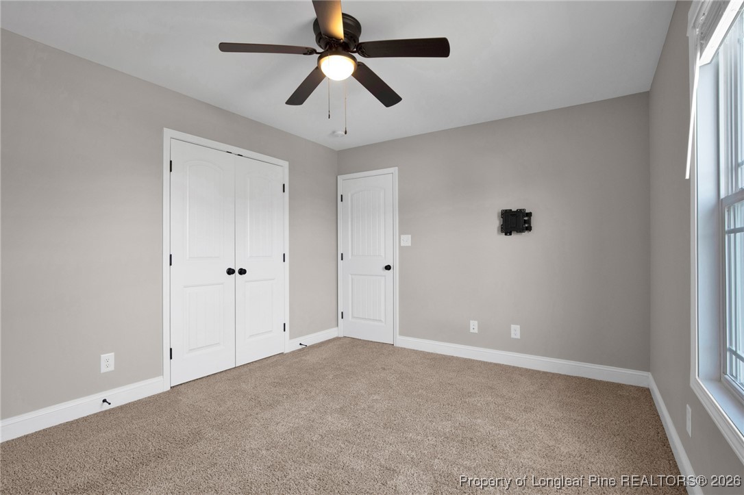 171 Tellmont Street Raeford, NC 28376 - Photo 34 of 46 an empty room with chandelier fan