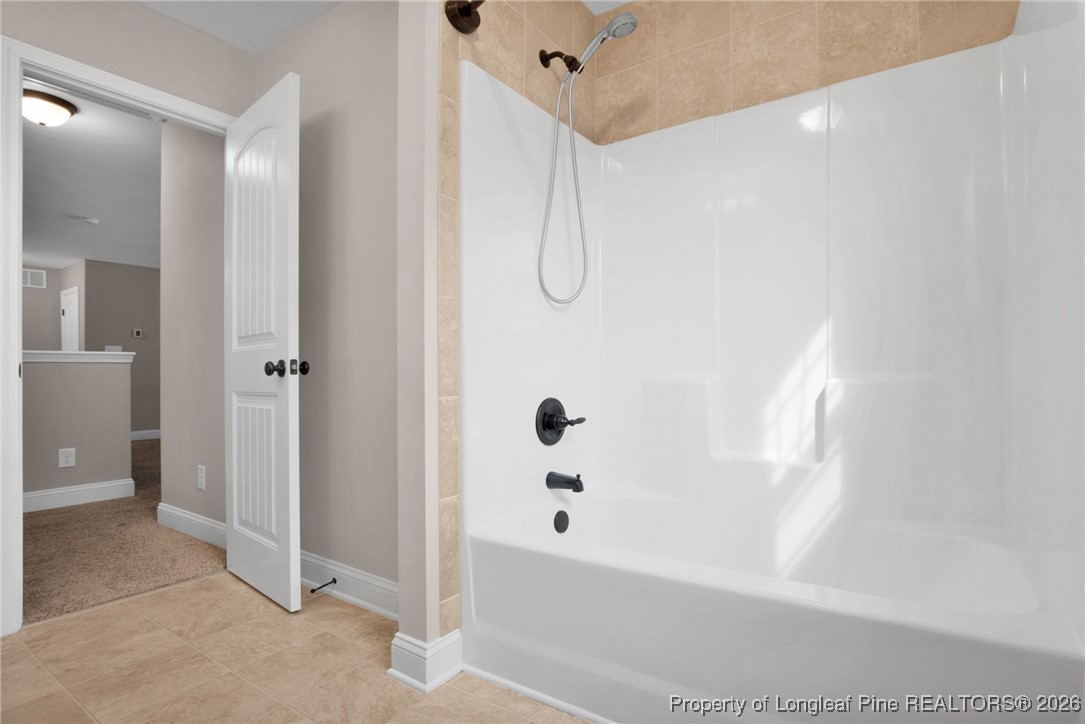 171 Tellmont Street Raeford, NC 28376 - Photo 40 of 46 a bathroom with a bathtub and a shower
