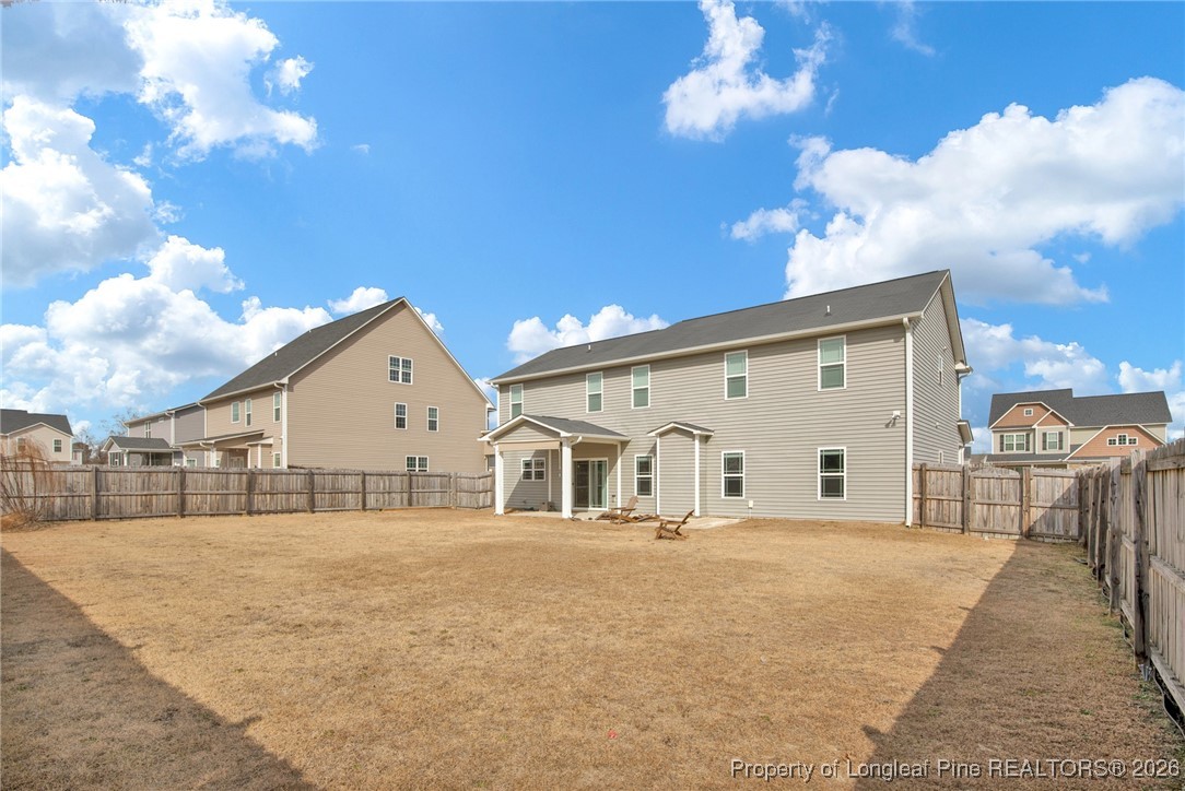171 Tellmont Street Raeford, NC 28376 - Photo 44 of 46 a view of a white house with a yard