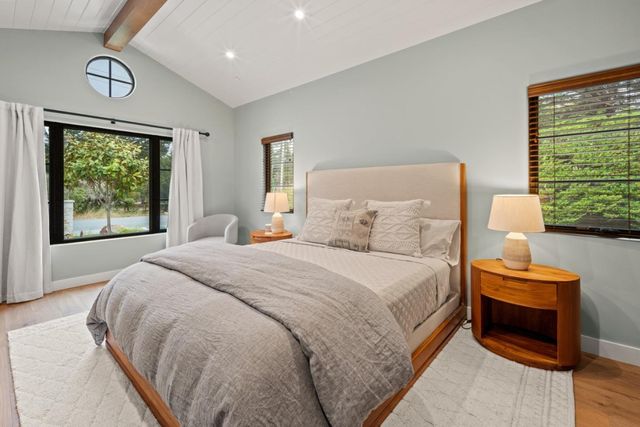 a bedroom with bed and a window