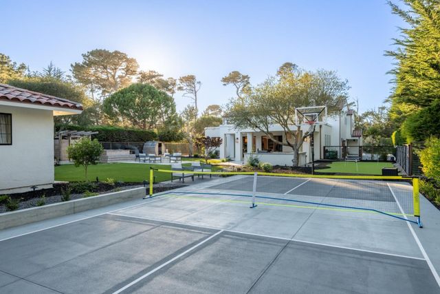 a view of a playground with basketball court