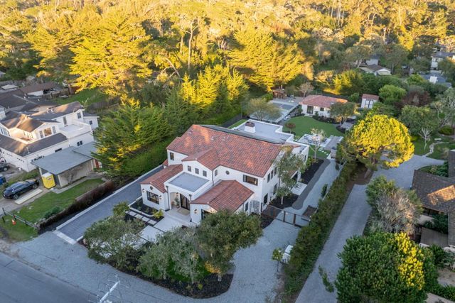 an aerial view of a house with a garden