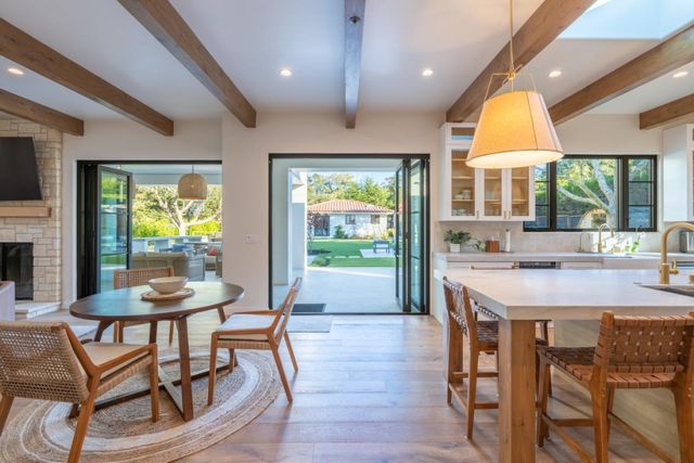 a kitchen with a table and chairs in it