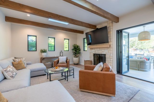 a living room with furniture and a fireplace