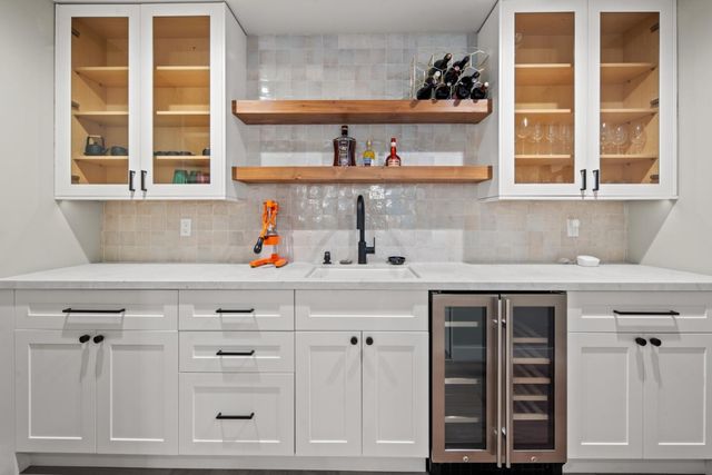 a kitchen with a cabinets and window