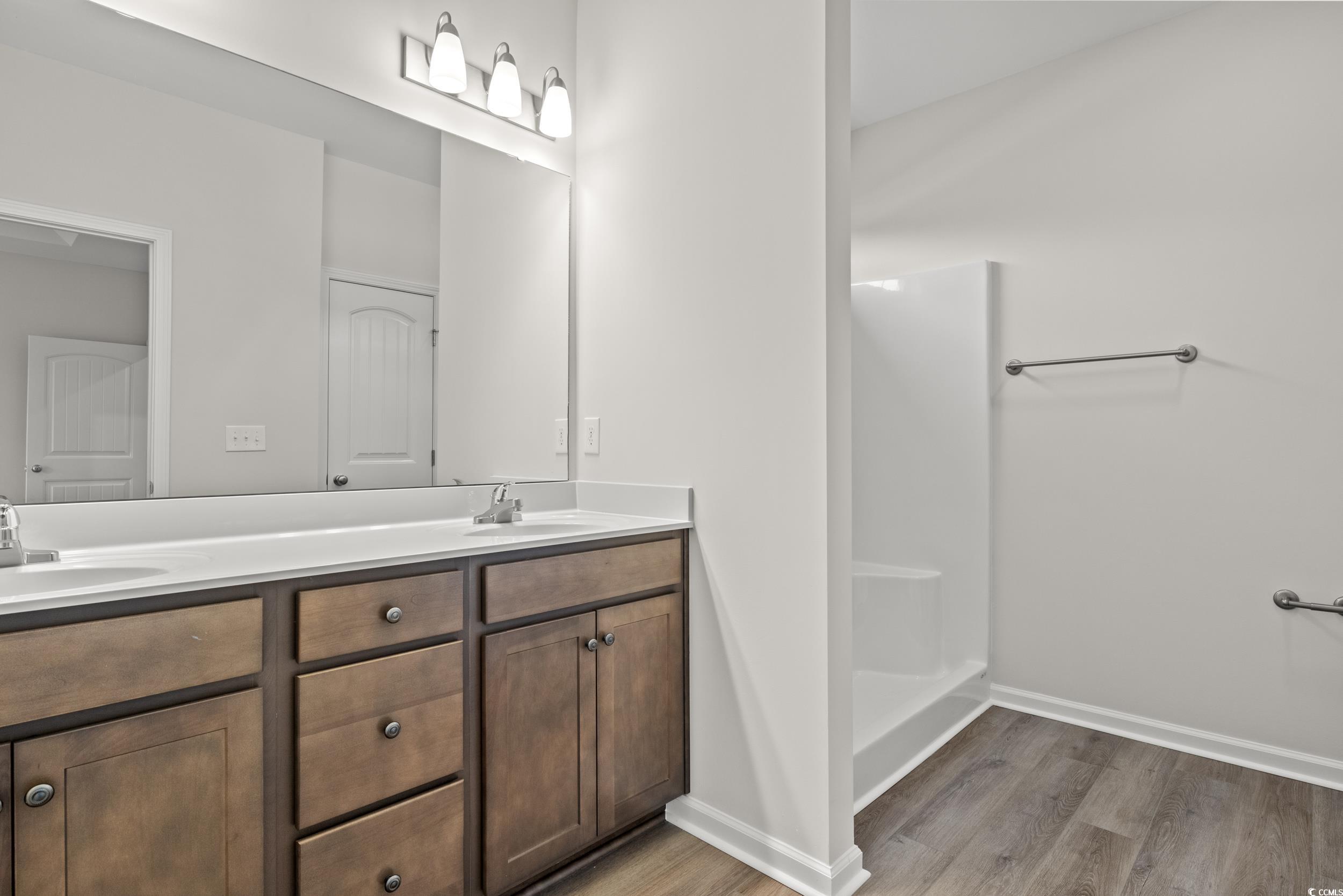 2064 Harris Short Cut Road Conway, SC 29526 - Photo 6 of 26 Bathroom with wood-type flooring, a shower, and va