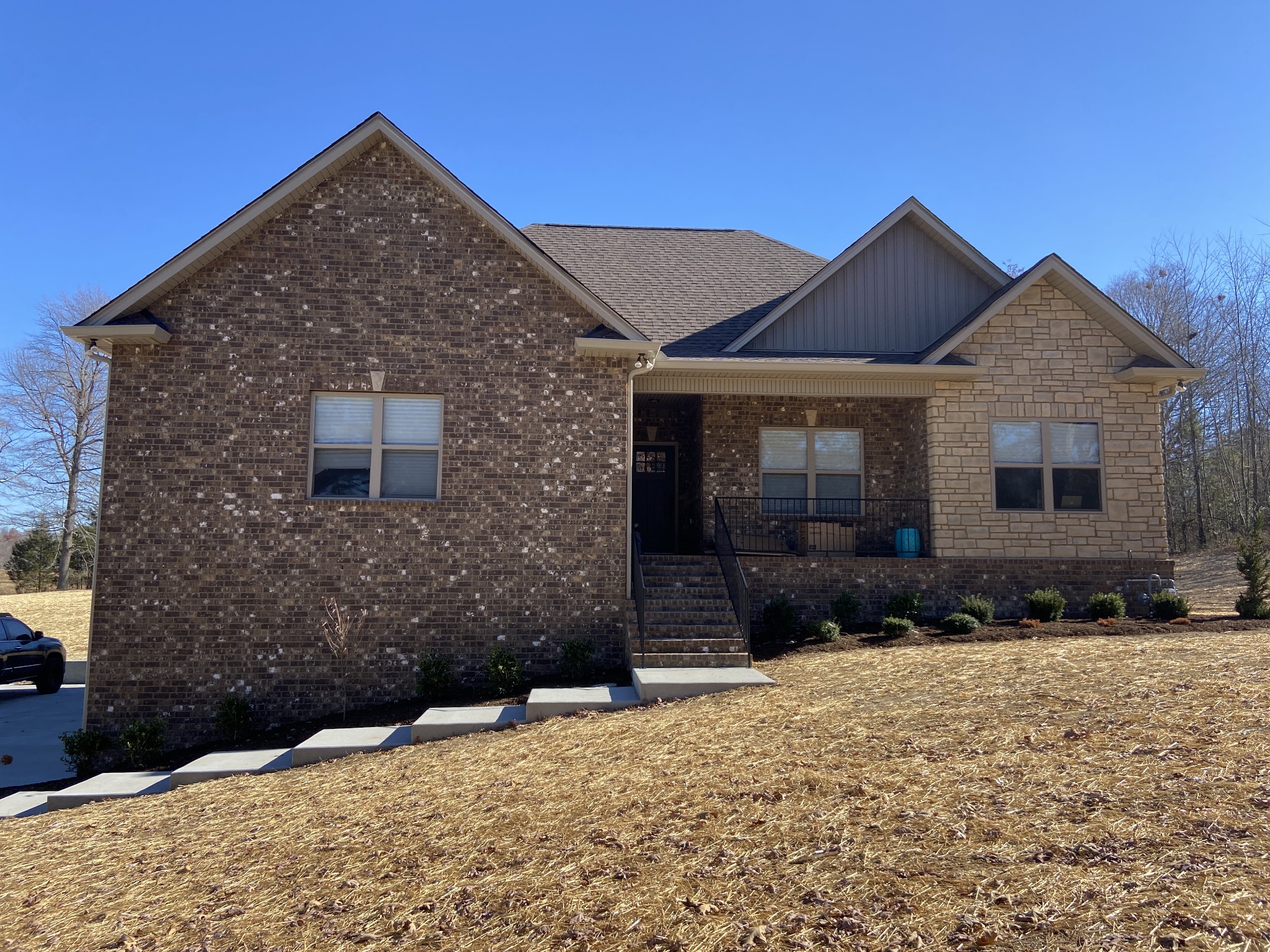 a front view of a house with a yard