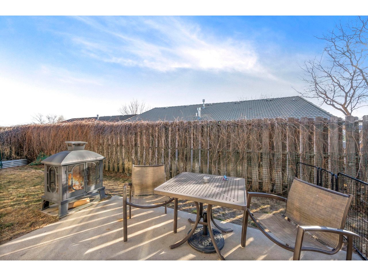 5225 West 11th Street Road Greeley, CO 80634 - Photo 12 of 17 a backyard of a house with table and chairs