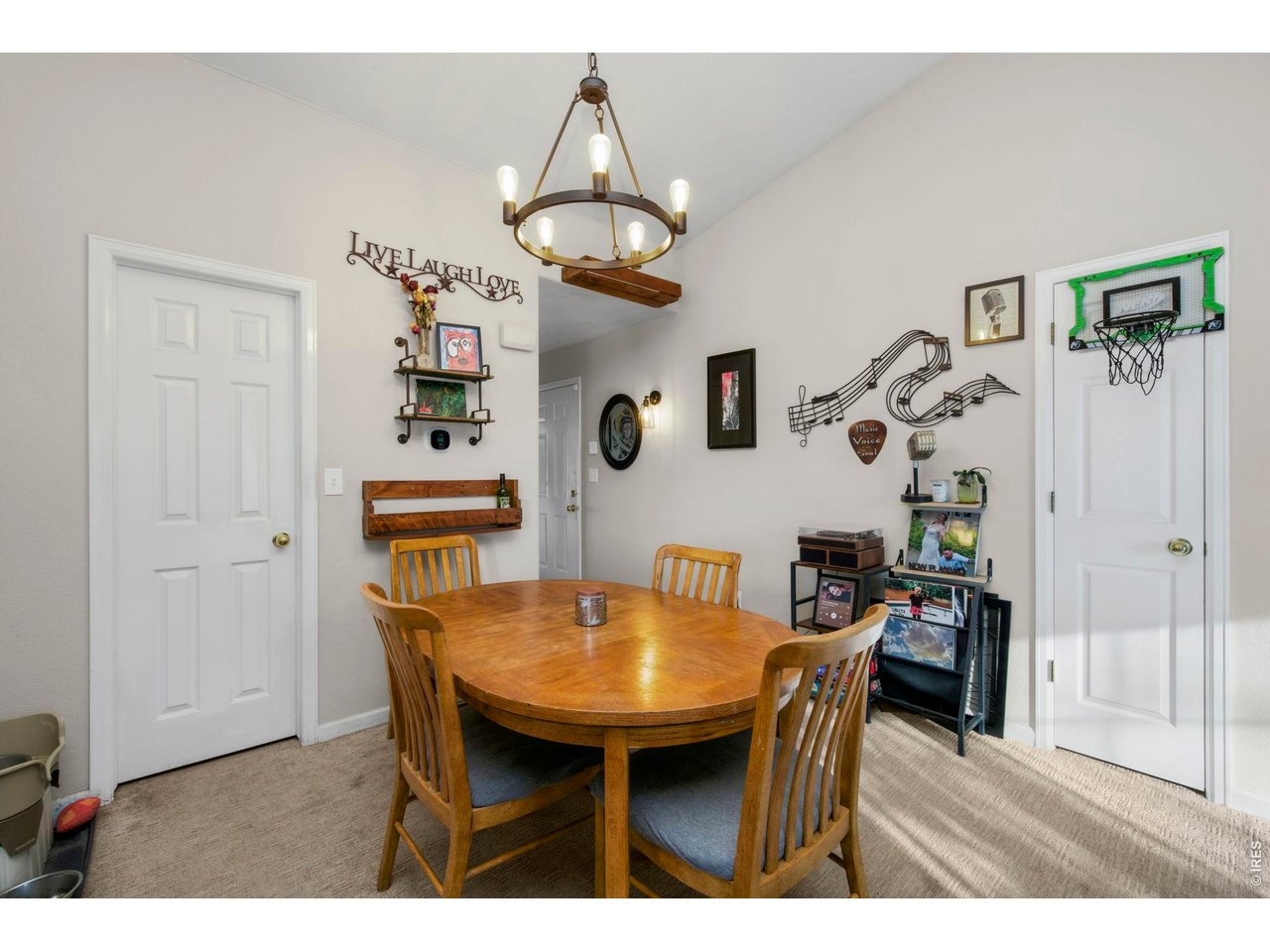 5225 West 11th Street Road Greeley, CO 80634 - Photo 14 of 17 a view of a dining room with furniture and wooden floor