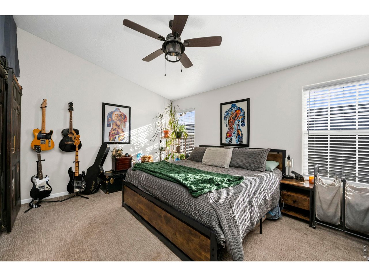 5225 West 11th Street Road Greeley, CO 80634 - Photo 3 of 17 a bedroom with a bed a couch and a window