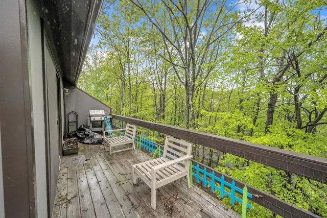 a view of balcony with furniture