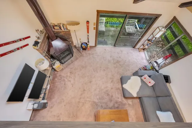 a view of living room with furniture and floor to ceiling window