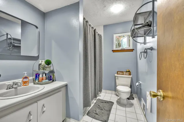 a bedroom with furniture and a chandelier