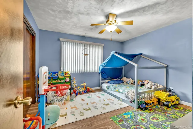 a room with toys and a book shelf