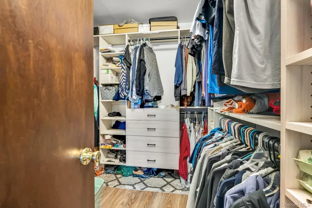 a bedroom with furniture and a window