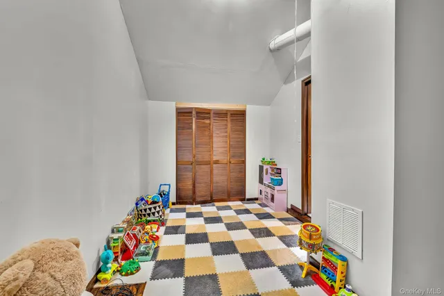 a living room with furniture a rug and a window