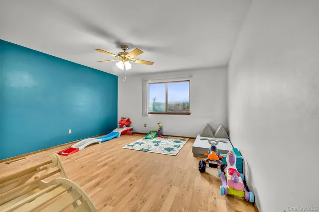 a bed room with a bed and a chandelier