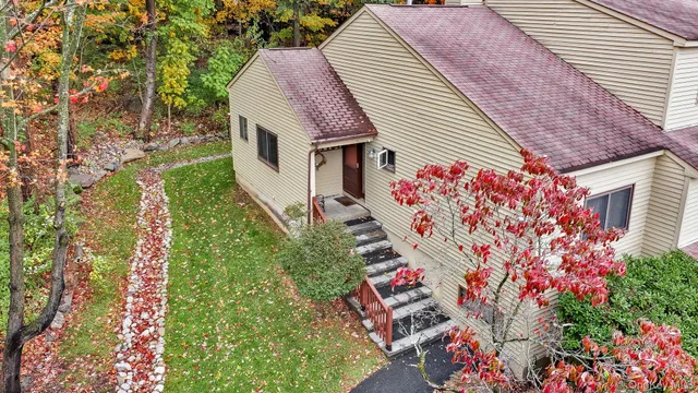 a aerial view of a house with a yard and garden