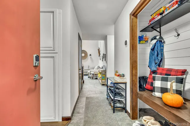 a open dining room with kitchen island furniture a large window with kitchen view