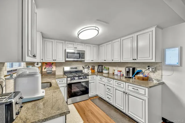 a view of a kitchen and workspace