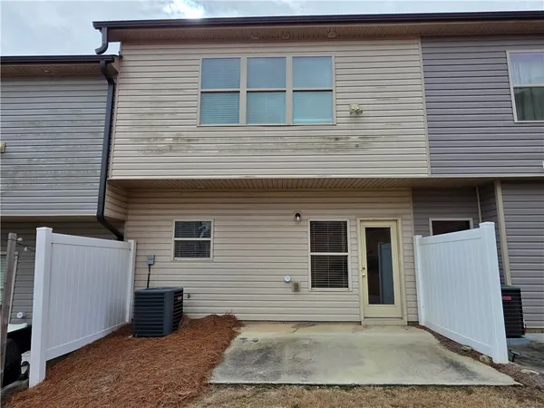 a view of a house with more windows and plants