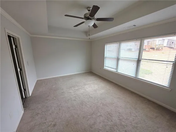a view of an empty room with a window