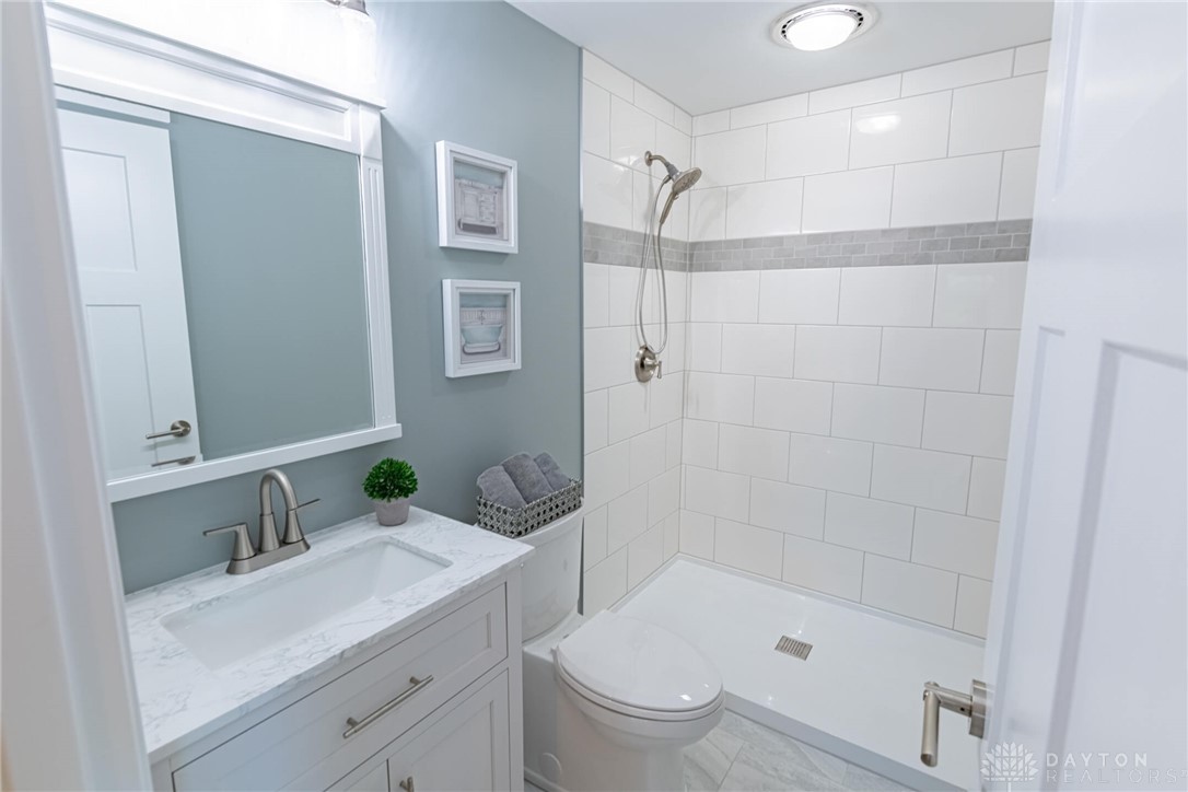 6026 Waterloo Road Dayton, OH 45459 - Photo 21 of 37 Primary private bath w/large floor to ceiling tiled shower & custom tile floor