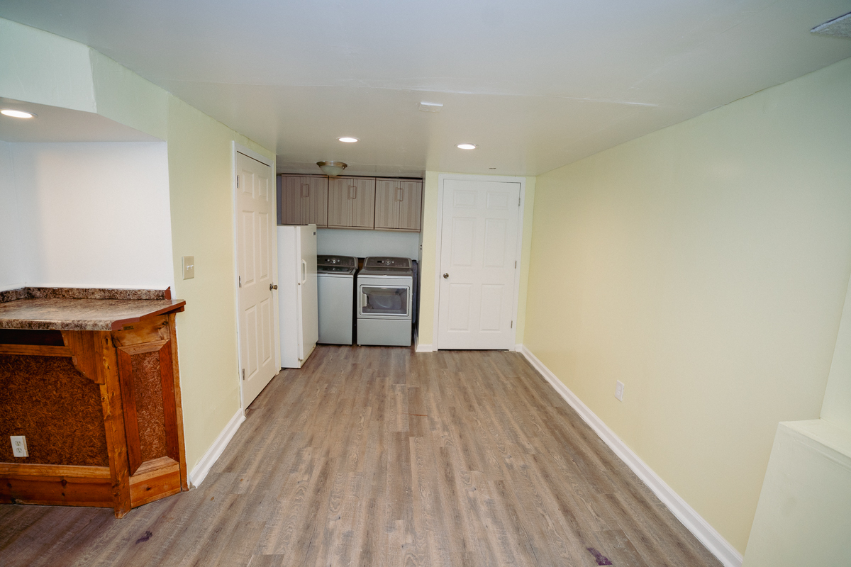 1221 Cedarwood Drive, Unit F Crest Hill, IL 60403 - Photo 16 of 35 a view of a kitchen with a sink and a refrigerator