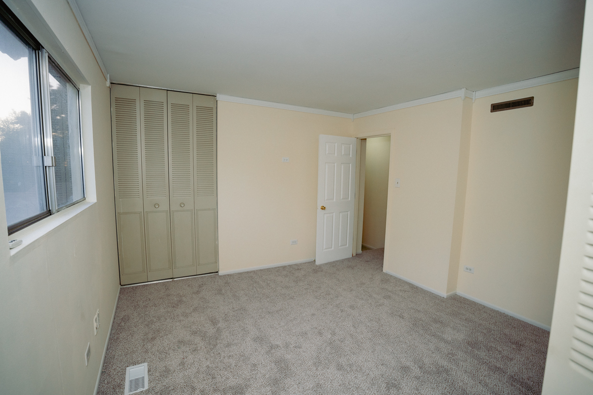 1221 Cedarwood Drive, Unit F Crest Hill, IL 60403 - Photo 23 of 35 a view of an empty room