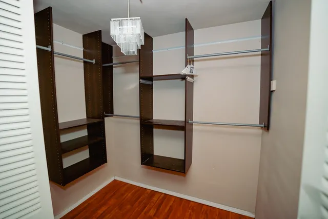 a view of an empty room with windows