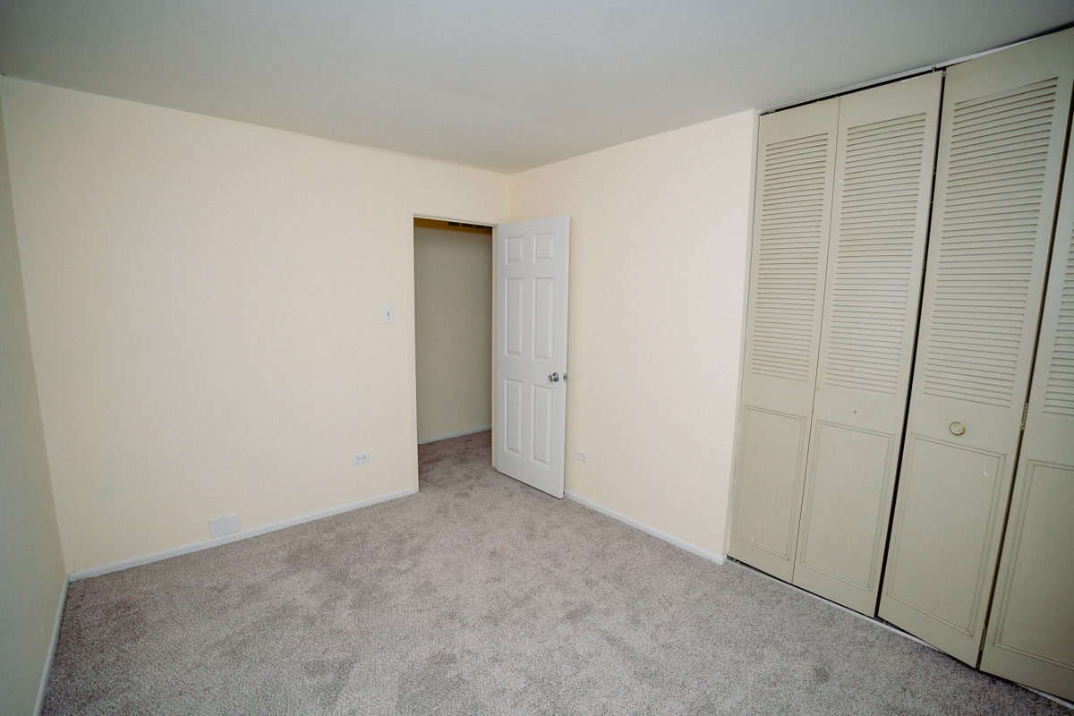 1221 Cedarwood Drive, Unit F Crest Hill, IL 60403 - Photo 29 of 35 a view of an empty room