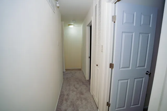 a view of a hallway with stairs