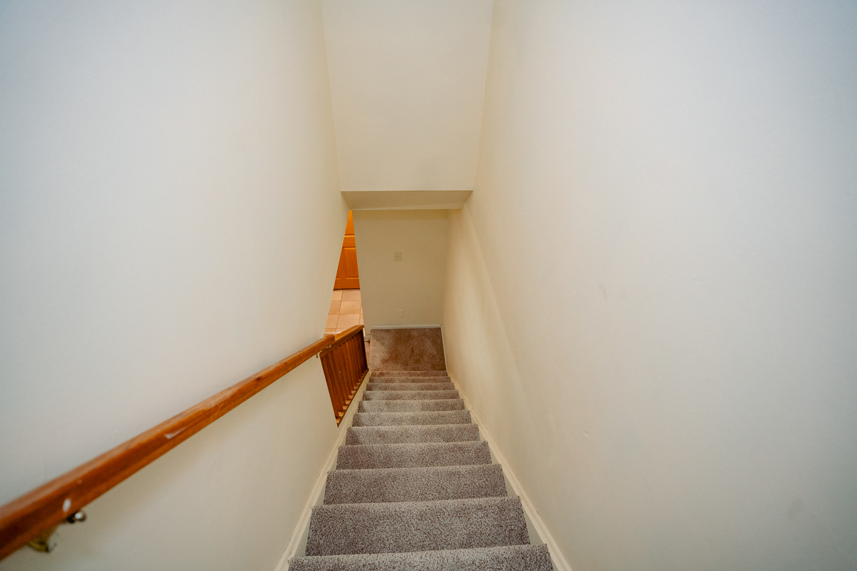 1221 Cedarwood Drive, Unit F Crest Hill, IL 60403 - Photo 32 of 35 a view of a hallway with stairs