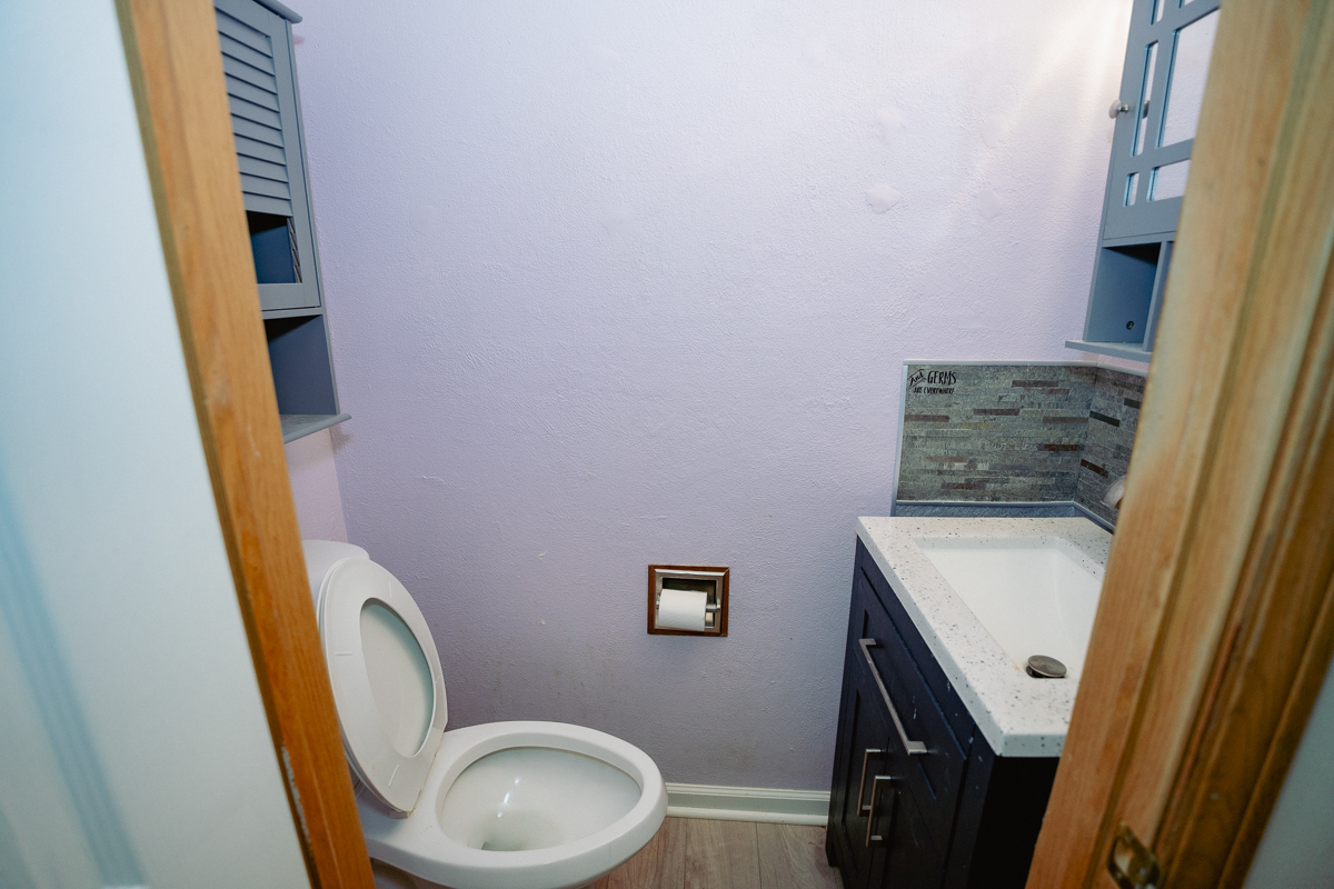 1221 Cedarwood Drive, Unit F Crest Hill, IL 60403 - Photo 7 of 35 a bathroom with a sink and toilet
