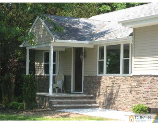 211 Lambertson Road Old Bridge, NJ 07747 - Photo 1 of 19 a front view of a house with a yard