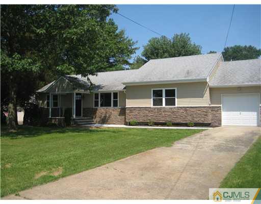 211 Lambertson Road Old Bridge, NJ 07747 - Photo 2 of 19 a front view of a house with a garden