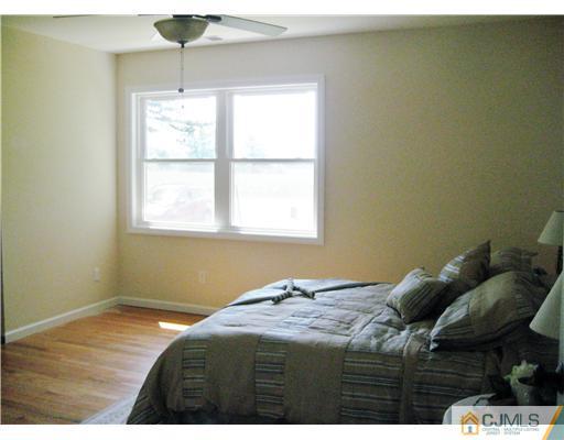 211 Lambertson Road Old Bridge, NJ 07747 - Photo 11 of 19 a bedroom with a bed and a window