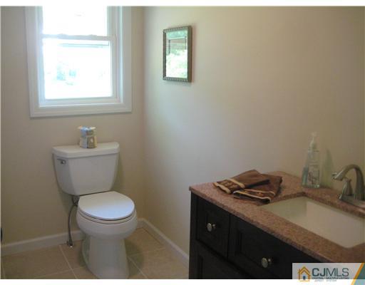 211 Lambertson Road Old Bridge, NJ 07747 - Photo 12 of 19 a bathroom with a sink toilet and a window