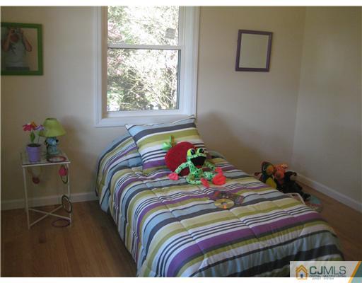211 Lambertson Road Old Bridge, NJ 07747 - Photo 14 of 19 a bedroom with a bed and a window