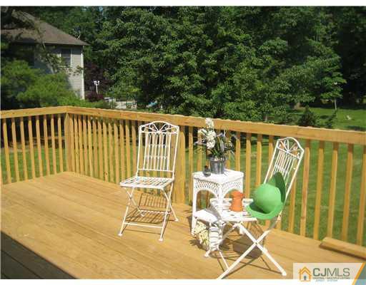211 Lambertson Road Old Bridge, NJ 07747 - Photo 15 of 19 a balcony with table and chairs