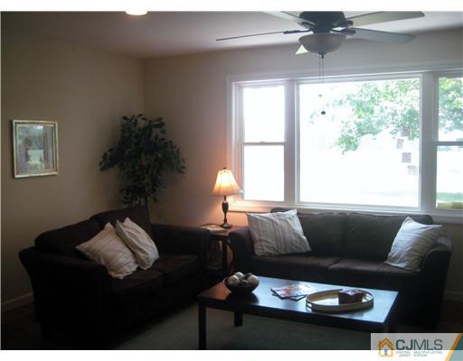 211 Lambertson Road Old Bridge, NJ 07747 - Photo 4 of 19 a living room with furniture and a large window